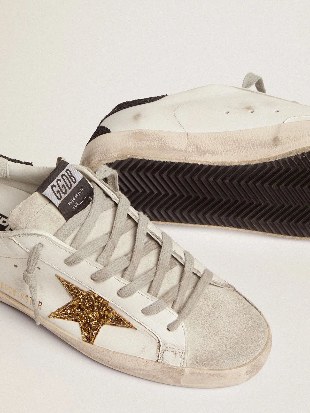 Super-Star sneakers with gold star and glittery black heel tab B40716